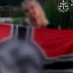 Повідомлено про підозру 23-річній киянці, яка поширила в Інстаграм фото з прапором Третього Рейху